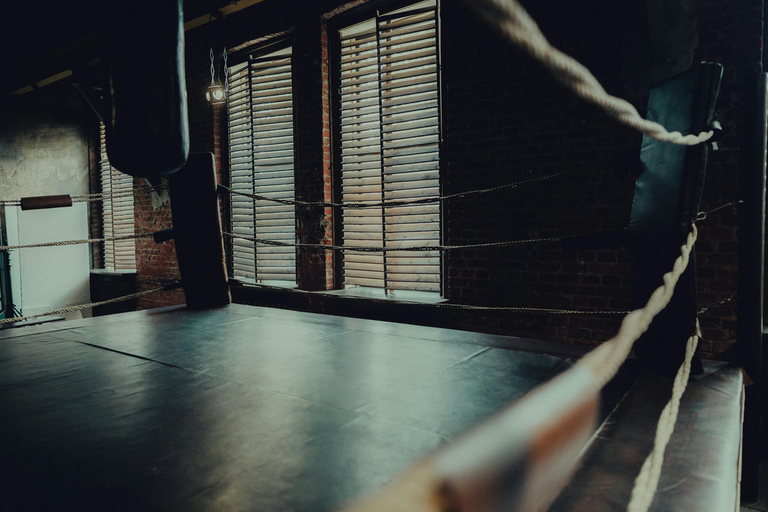 Atmospheric empty boxing ring with moody lighting